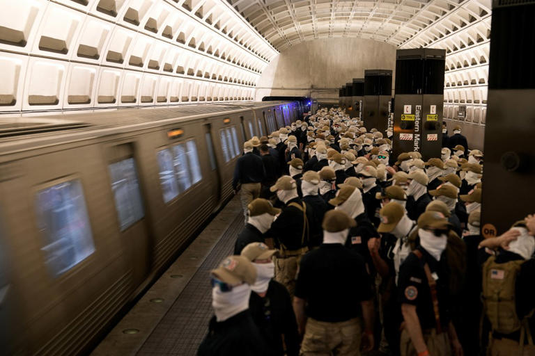 Chilling photo shows black woman on DC train surrounded by white ...
