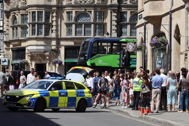 Fresh pictures emerge after armed police abruptly close city centre ...