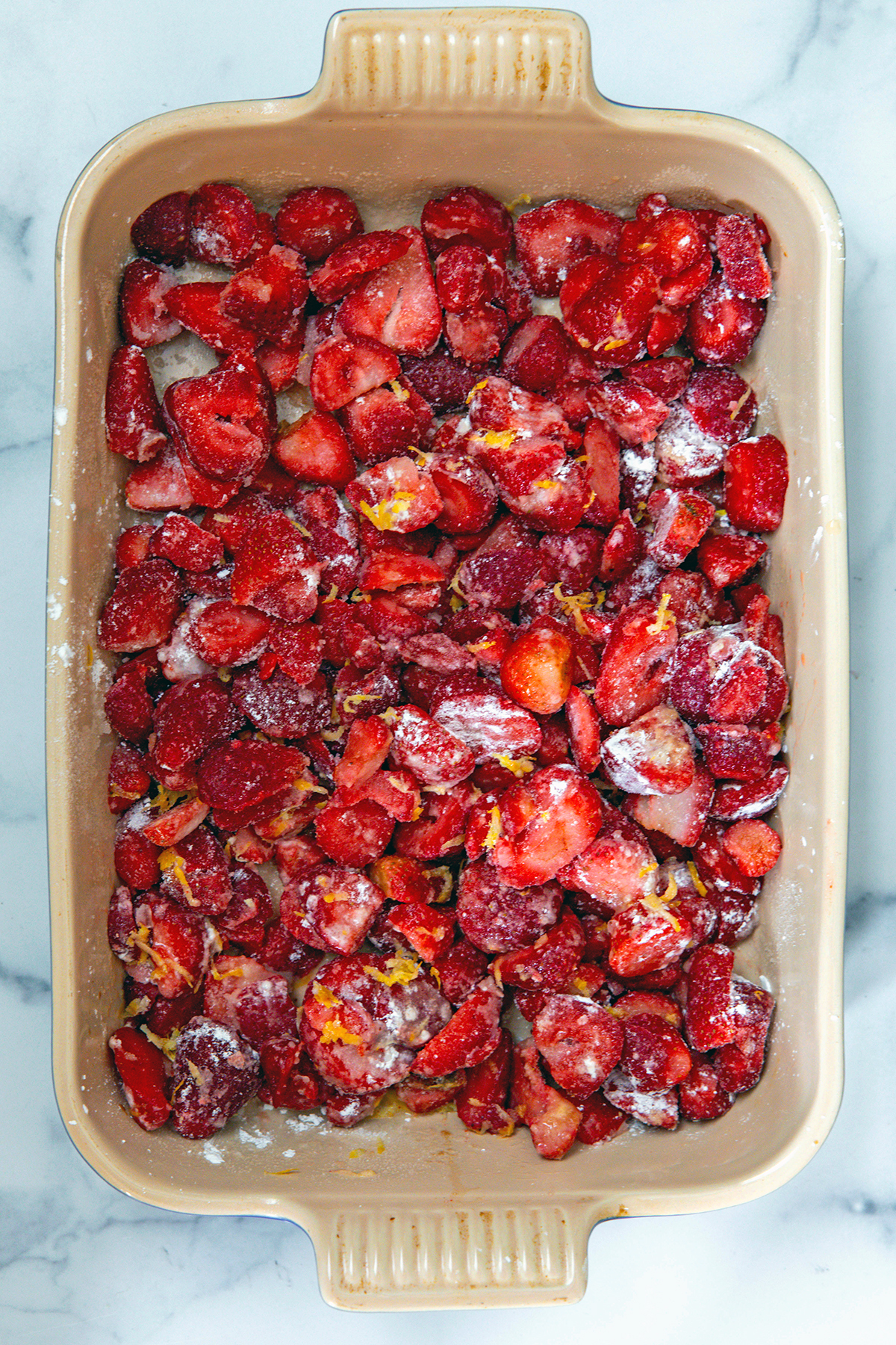 Strawberries, lemon zest, lemon juice, cornstarch in baking dish.