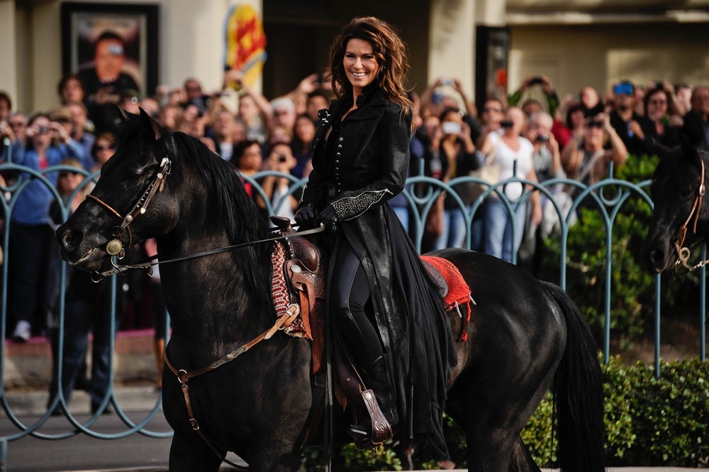 Nov. 14, 2012; Las Vegas, NV, USA; Fans line the street as country singer Shania Twain rides a horse down Las Vegas Blvd. for a welcome ceremony in front of Caesars Palace. Twain begins a 2-year residency at the casino - hotel on Dec. 1. Mandatory Credit: Robert Hanashiro/USA TODAY NETWORK