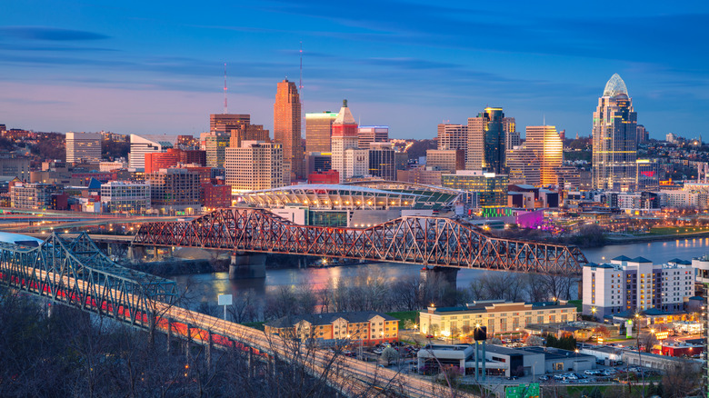 An arial view of Downtown Cincinnati, the Ohio River, and bridges at dusk.