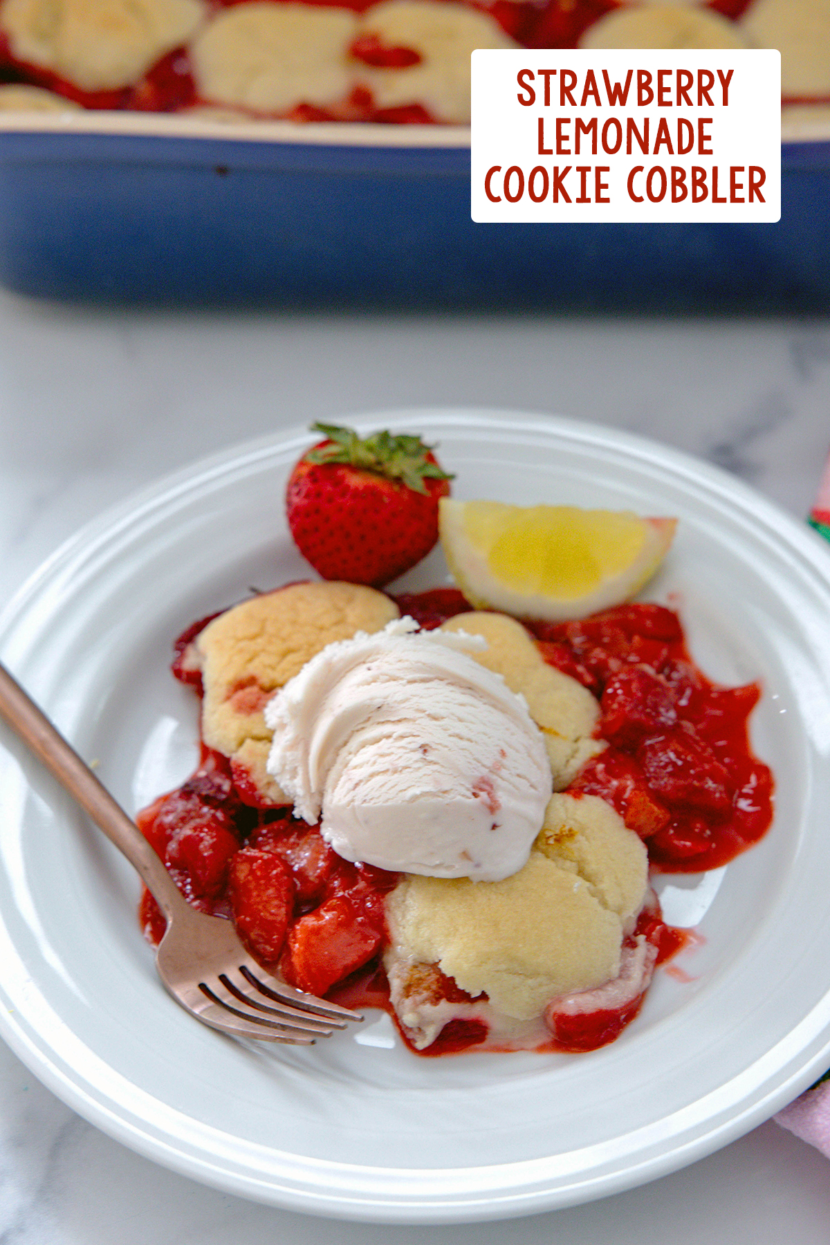 Strawberry lemonade cobbler on a plate topped with strawberry ice cream with recipe title at top of photo.