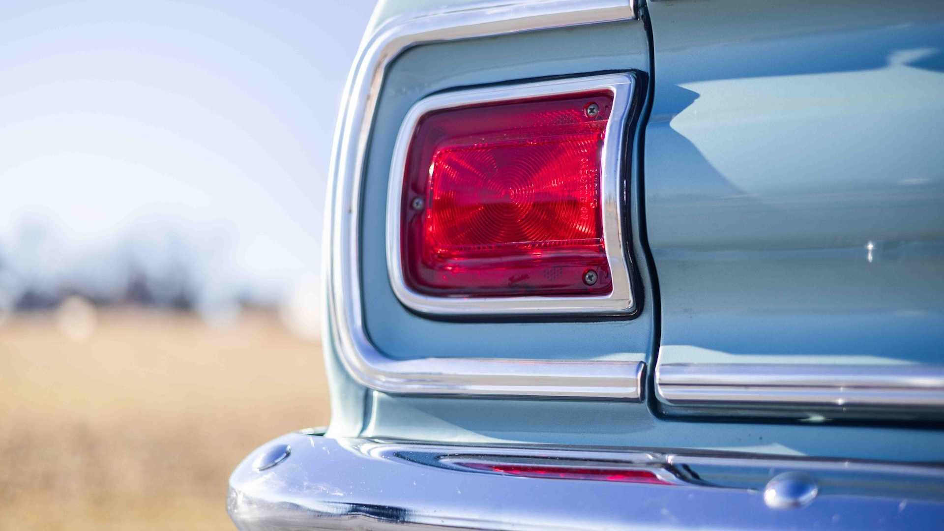 Red tail light in a blue Chevrolet classic car
