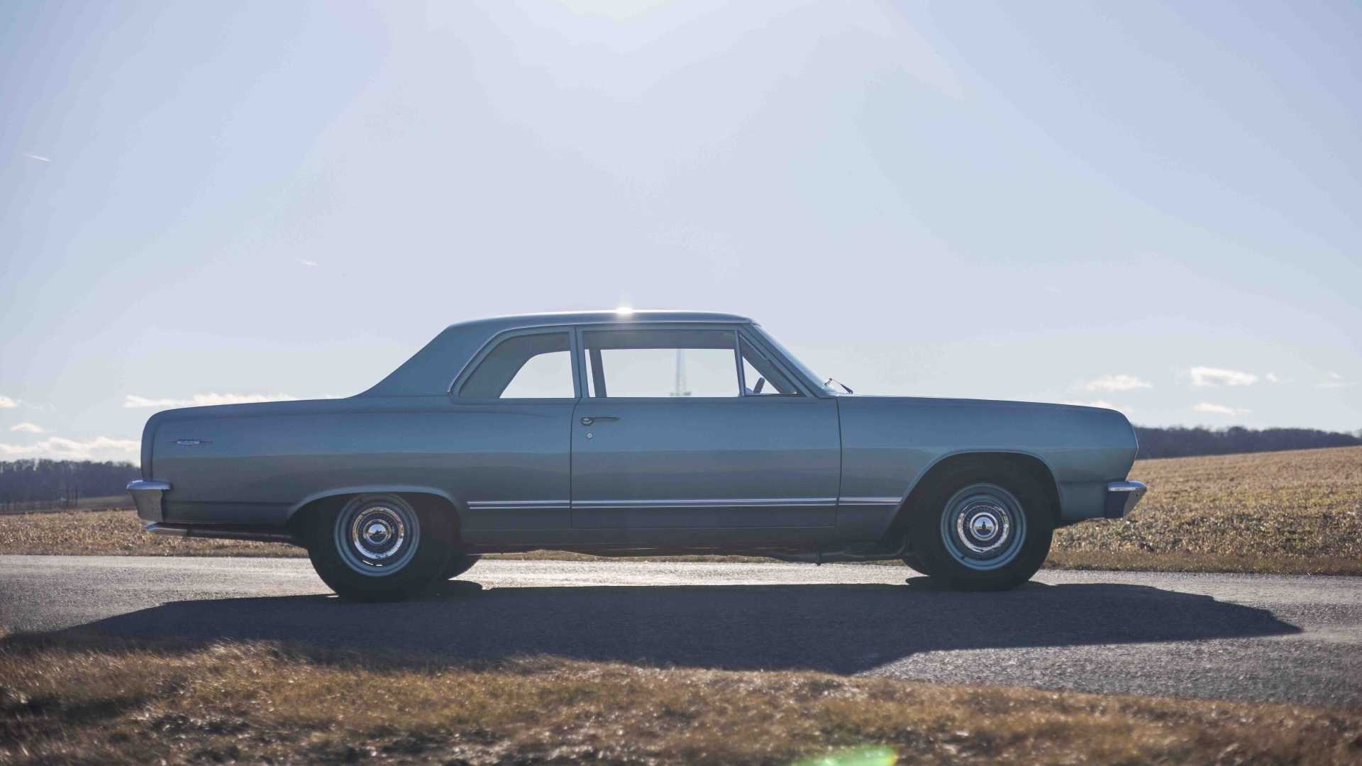The silhouette of a classic Chevrolet car.