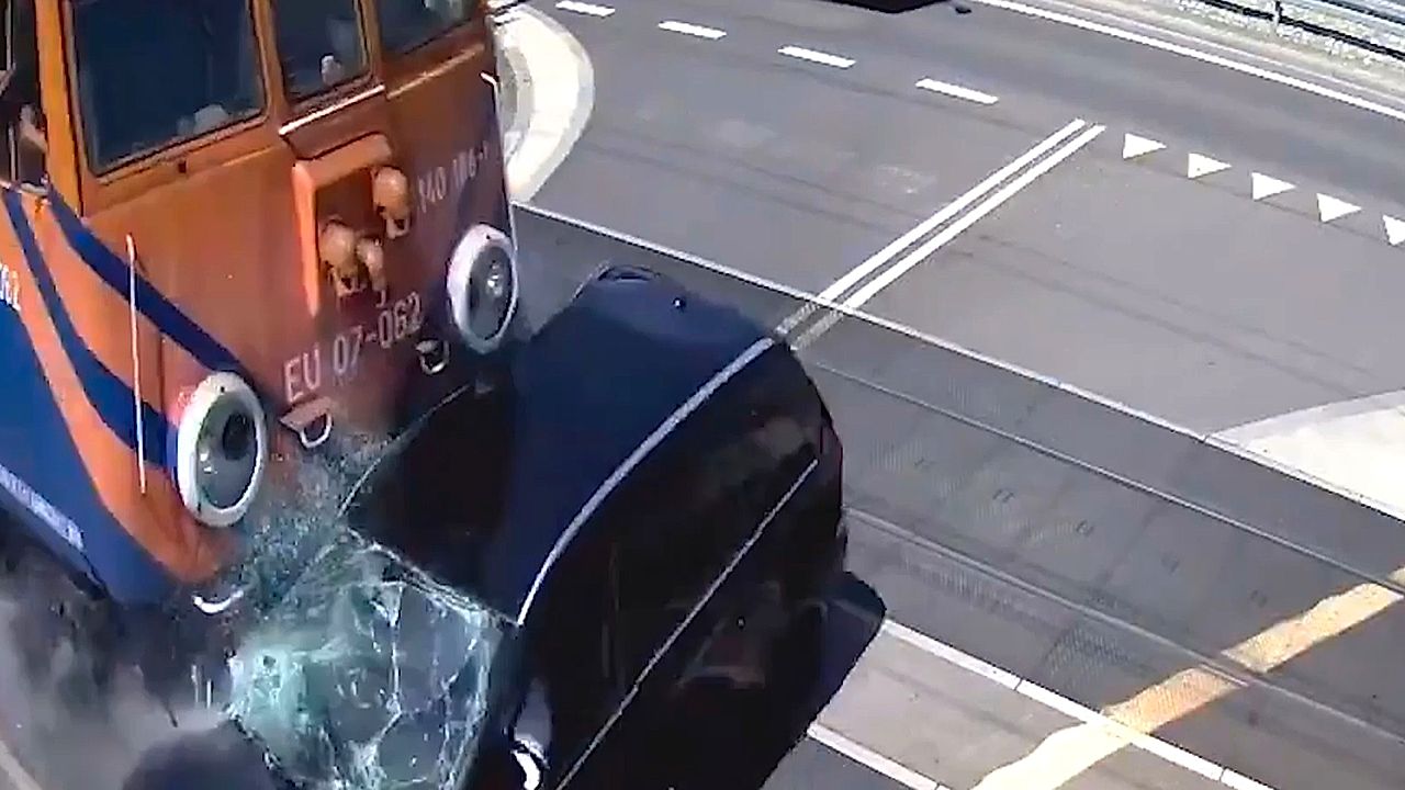 Young driver ignores warning light as freight train slams into car in ...