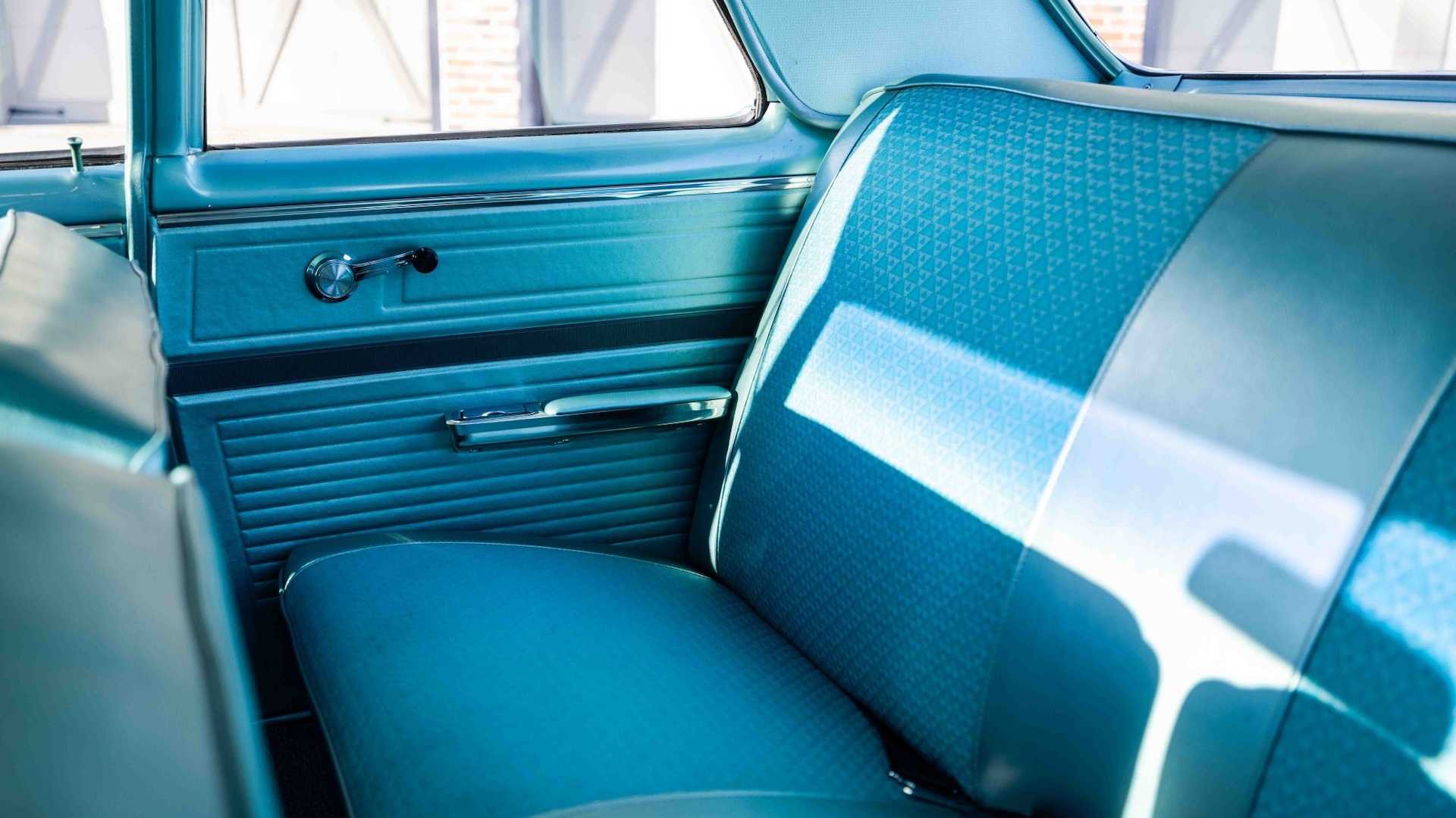 The turquoise rear seat in a classic Chevrolet