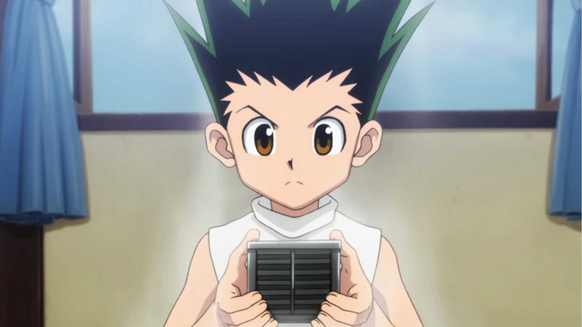 Gon looks serious as he holds a box in Hunter x Hunter (2011).