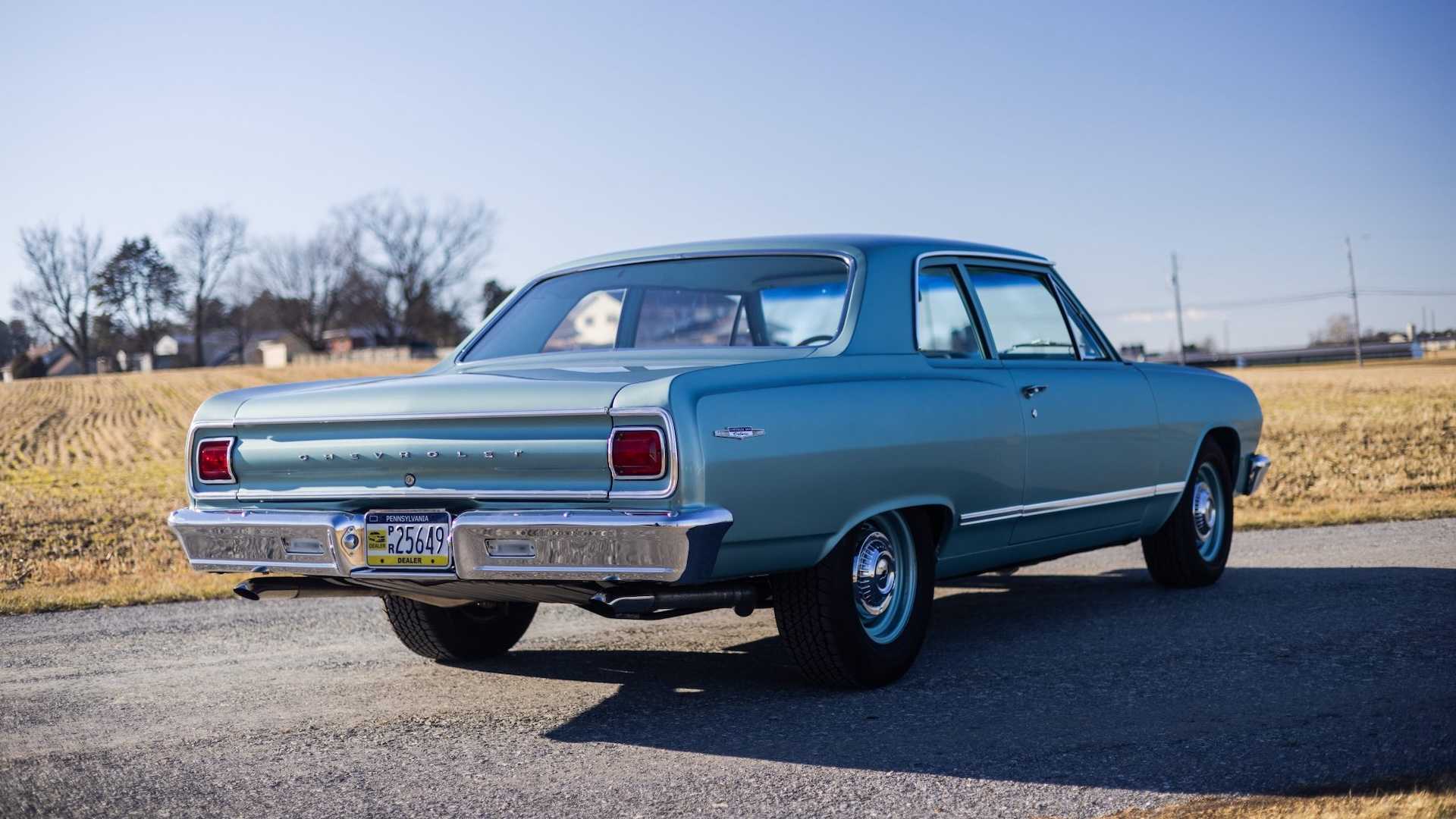 Rear quarter of a classic turquoise Chevrolet car