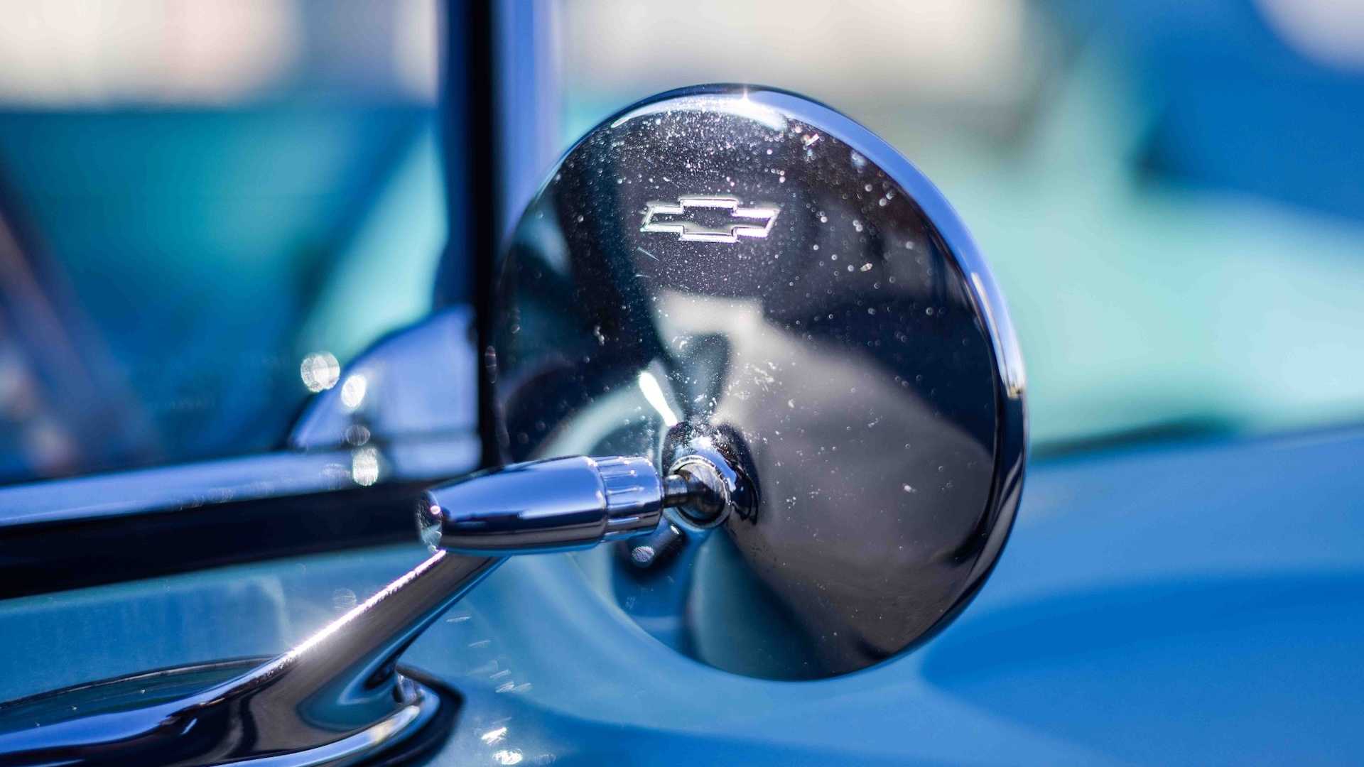 The chrome wing mirror on a classic Chevrolet car