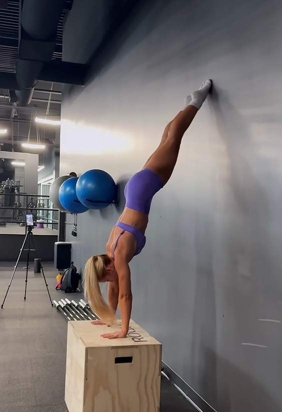 Wall split challenge for flexibility, balance, and mobility training
