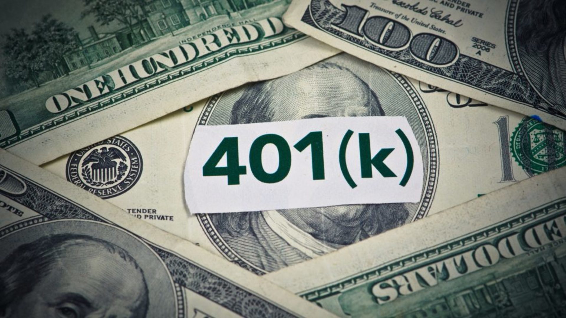 Discover an image depicting some hundred dollar bills and a paper reading 