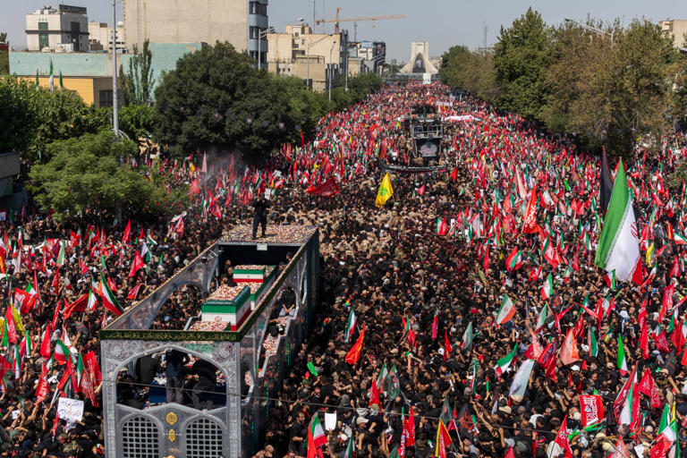 The funeral procession drew a vast crowd in Tehran on Monday.