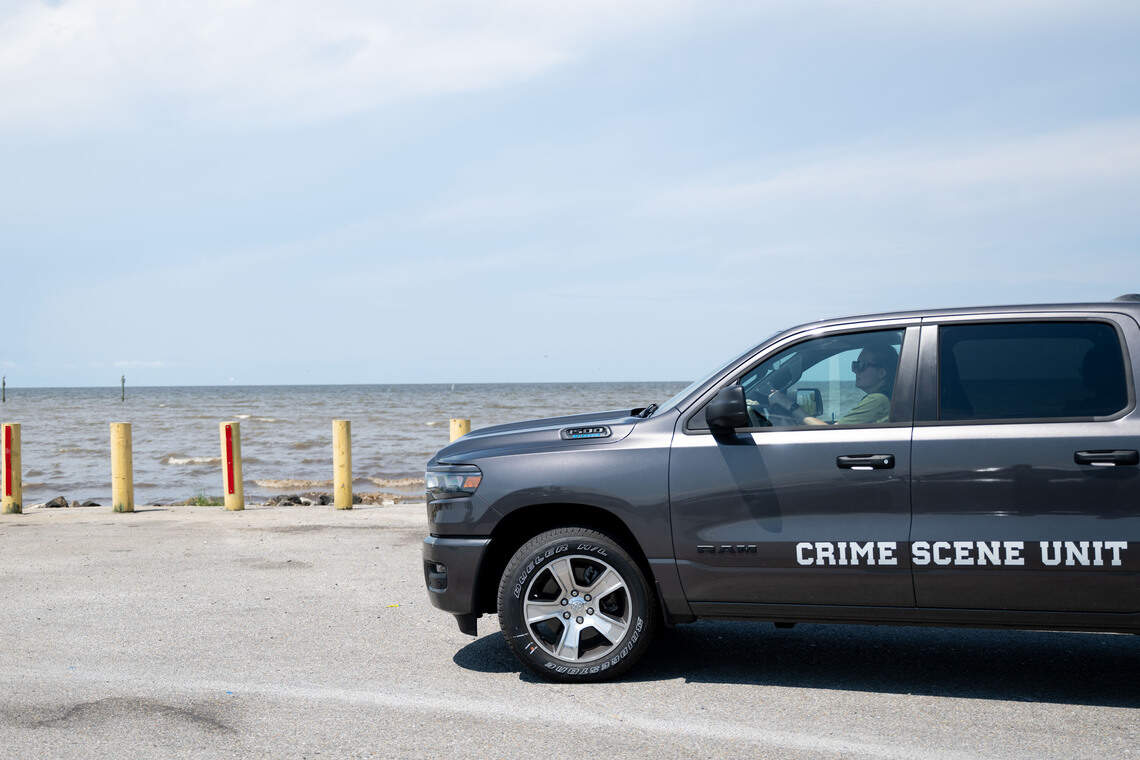A truck from the Jackson County Crime Scene Unit drives in Monday at Lake Mars Boat Launch.