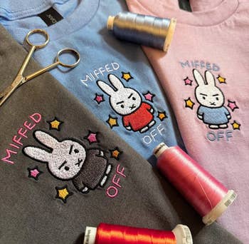 Three embroidered shirts with a cute, grumpy bunny design, titled
