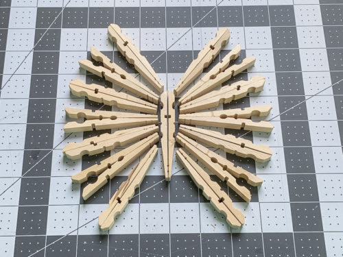 Clothespins laid out in a butterfly shape