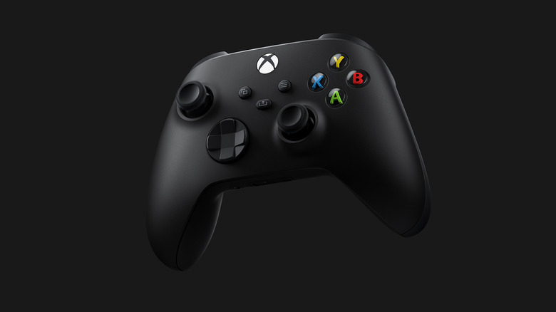 A black Xbox controller against a black backdrop