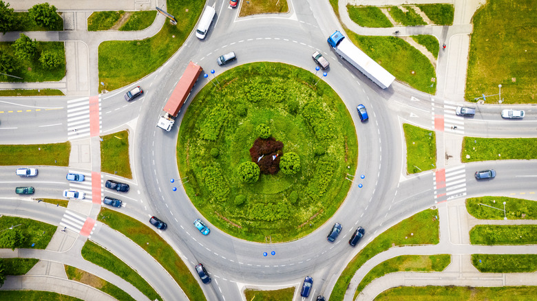 Aerial view of busy roundabout with heavy traffic