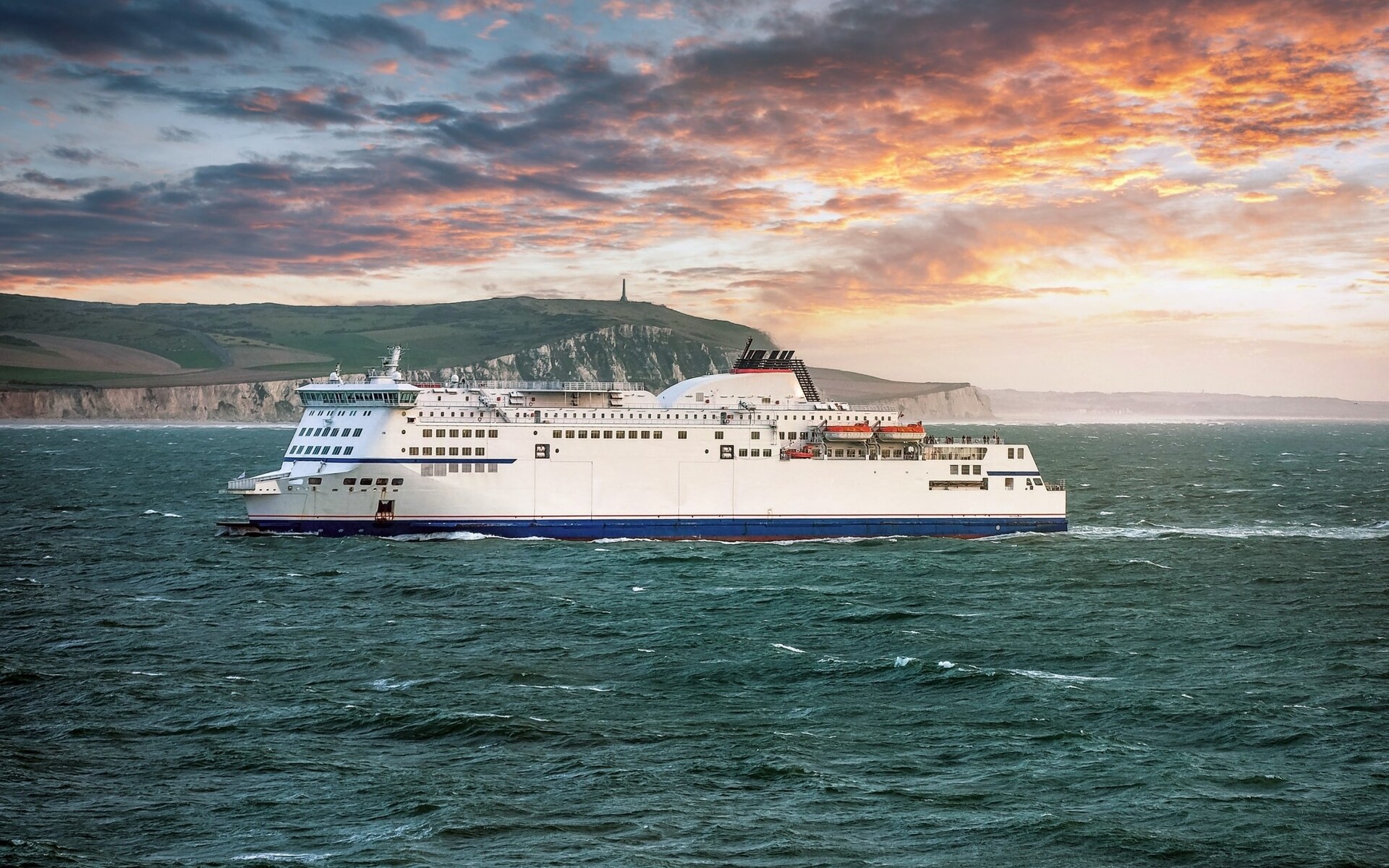 Ferry crossing the English Channel at sunset
