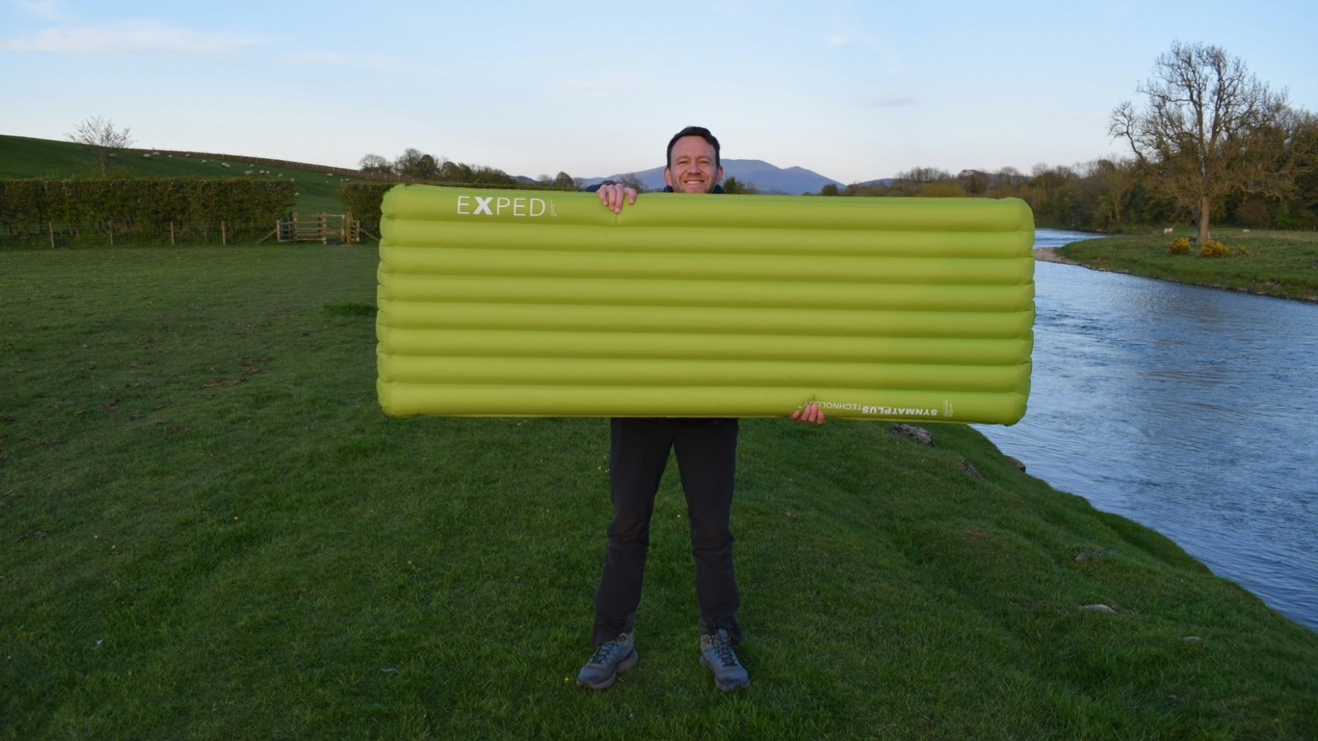 James holding the inflated Exped Ultra 6.5R sleeping mat horizontally