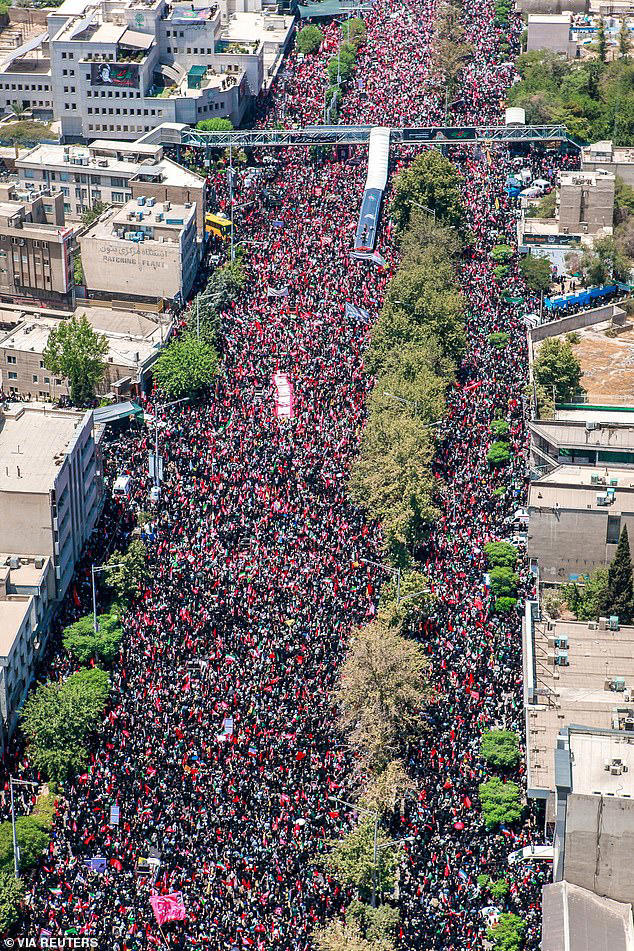 People attend a funeral procession for Iran's late Supreme Leader Ayatollah Ali Khamenei, who was killed on February 28 in Israeli and U.S. airstrikes, in Tehran, Iran July 6, 2026
