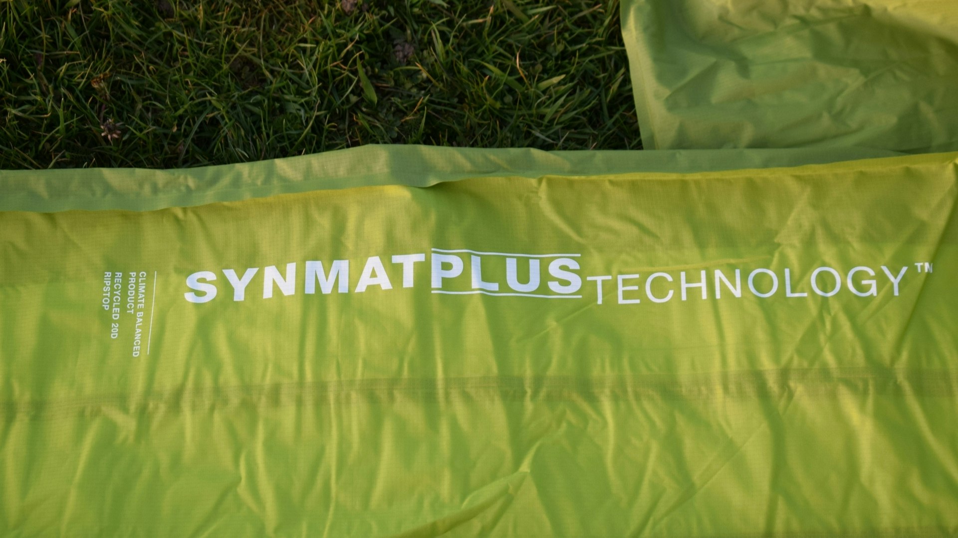 Close up of the Exped Ultra 6.5R sleeping mat with SYNMAT PLUS TECHNOLOGY branded on the side