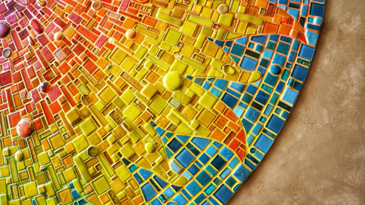 A cracked brick is the perfect canvas for this garden path mosaic DIY