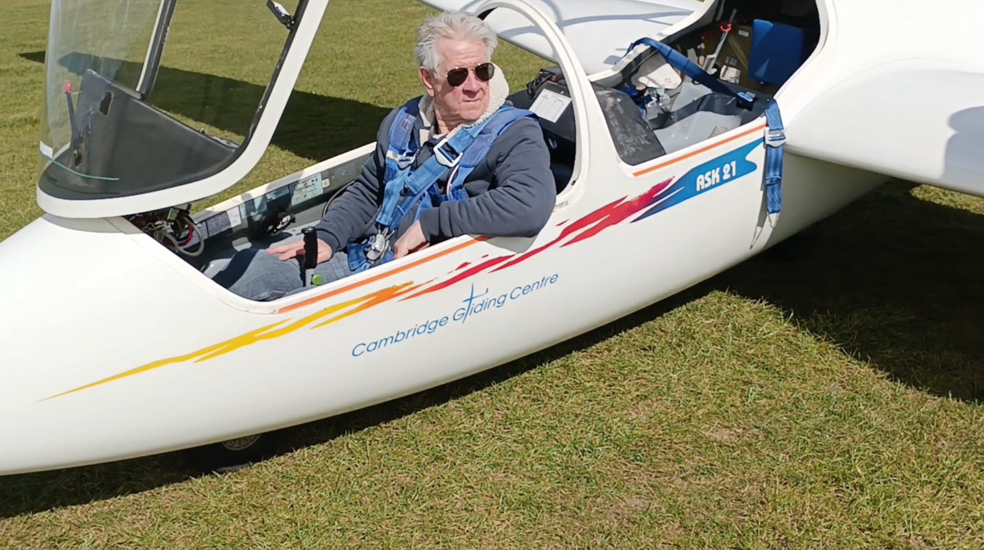 Man in plane with sunglasses on