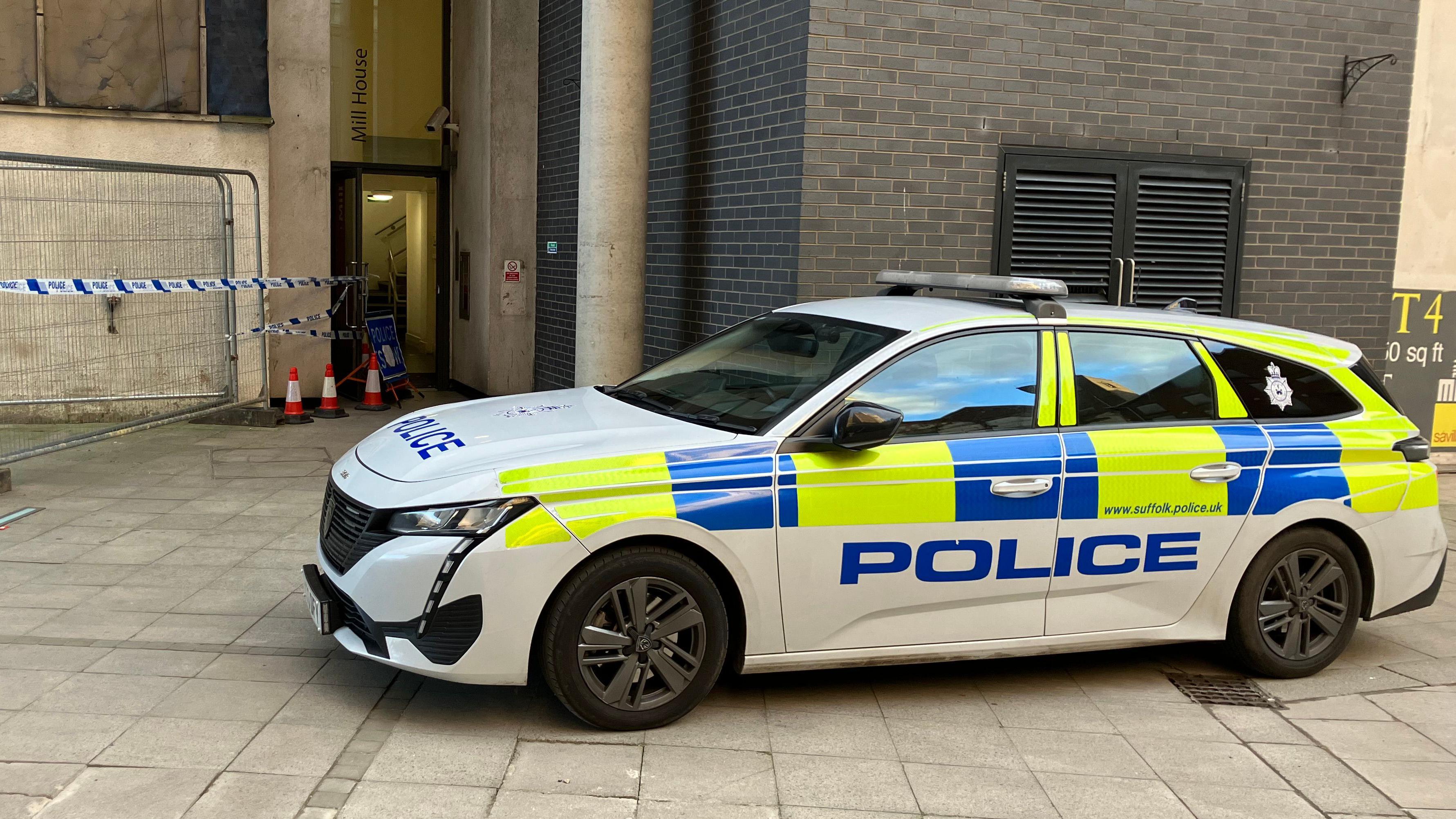 Suffolk Police maintained a presence outside the block of flats after the alleged murder