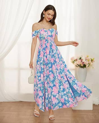 model in off the shoulder blue gown with pink flowers