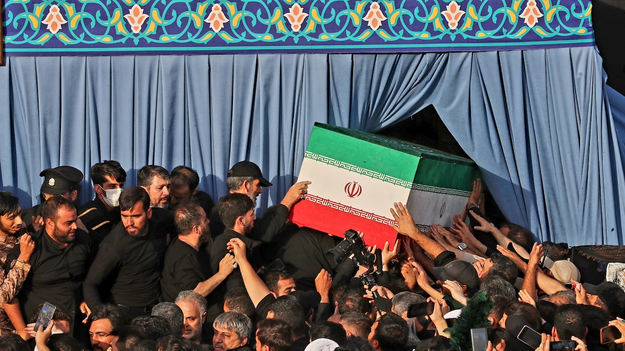 Mourners carry the coffin of the late Iranian Supreme Leader Ayatollah Ali Khamenei during funeral prayers held as part of the days-long funeral ceremonies at the Holy Jamkaran Mosque in Qom, Iran, on July 7.