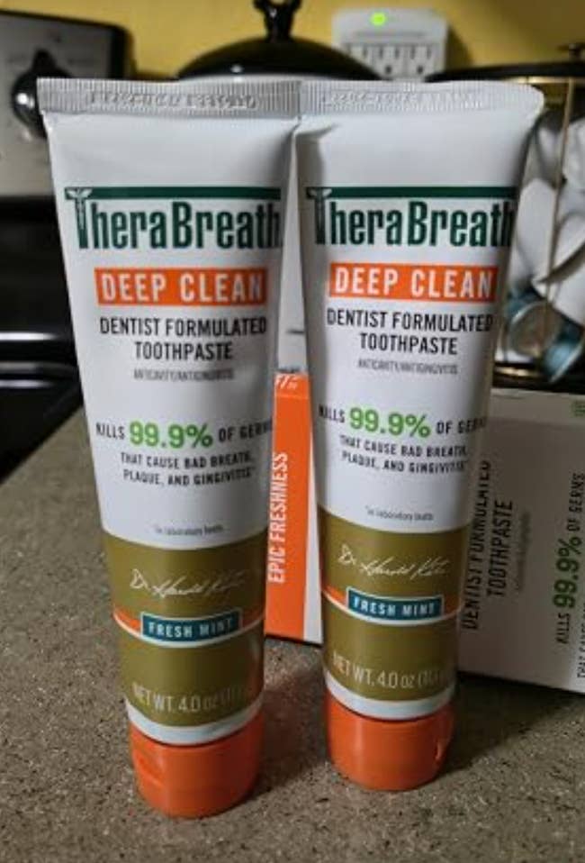 Two tubes of TheraBreath Deep Clean toothpaste, dentist formulated, claiming to kill 99.9% of germs that cause bad breath, plaque, and gingivitis