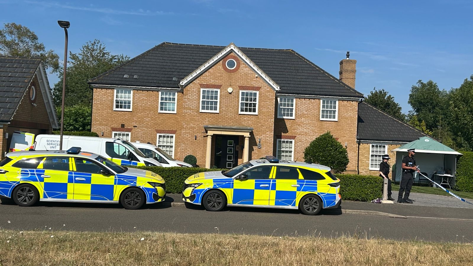 Suspect on the run after mother and two children found dead at home