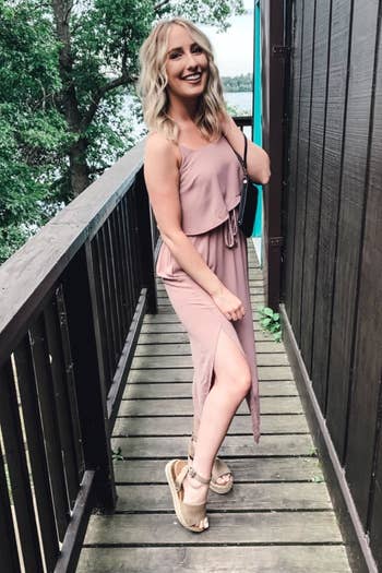 A different reviewer wearing the dress in pale pink