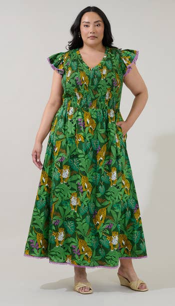 model in green leaf and leopard printed short ruffle sleeve dress