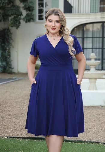 model in solid royal blue version with hands in pockets