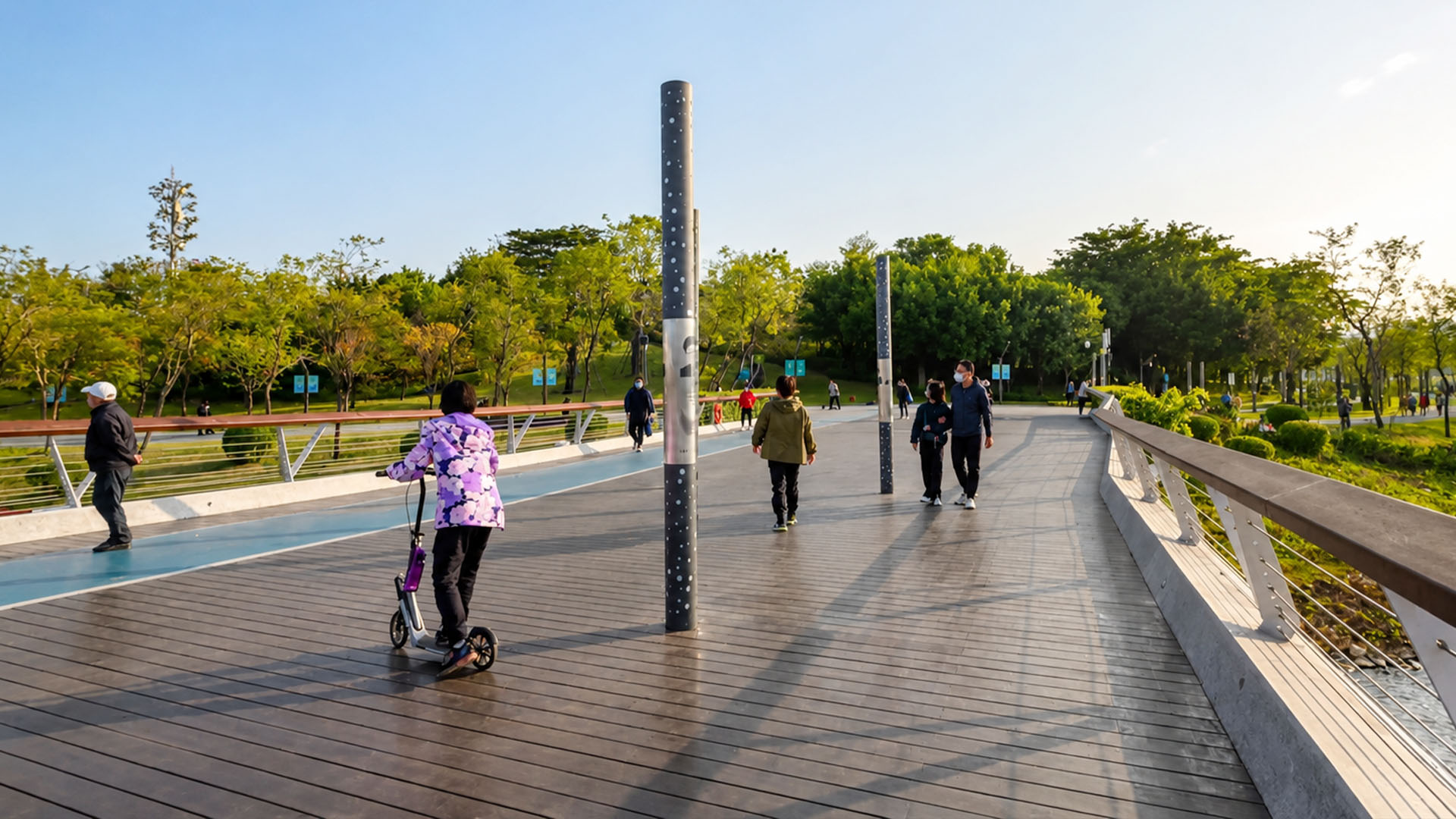 Inside a modern park featuring wide elevated walkways and green open spaces