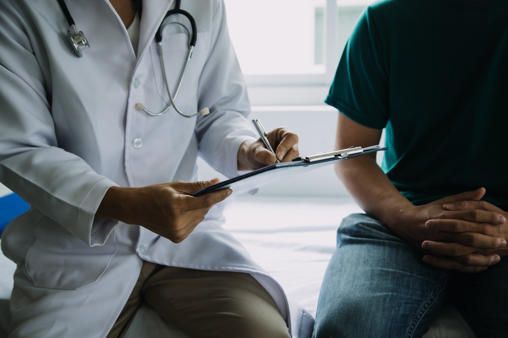 Male patient having consultation with doctor