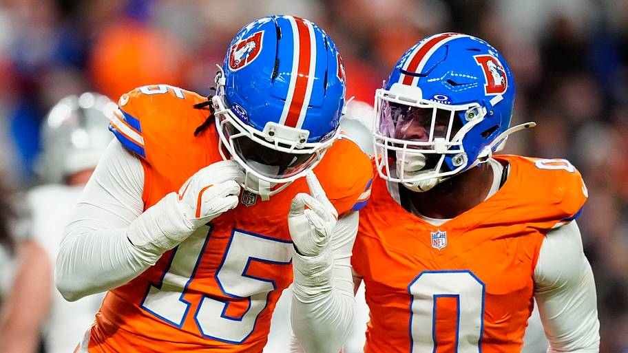 Nov 6, 2025; Denver, Colorado, USA; Denver Broncos linebacker Nik Bonitto (15) and linebacker Jonathon Cooper (0) react durin