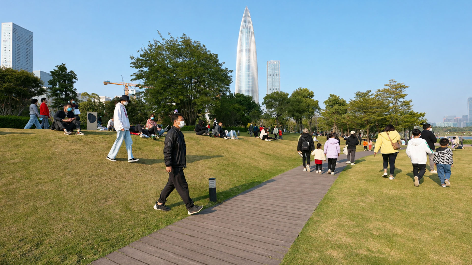This city park combines open green spaces with a modern skyline view