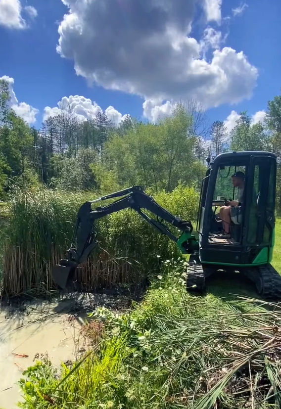 First time operating a machine while dredging pond edges