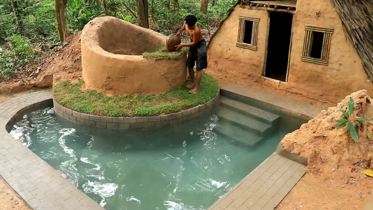 Watch two men craft a hidden shelter with a pool using natural water ...