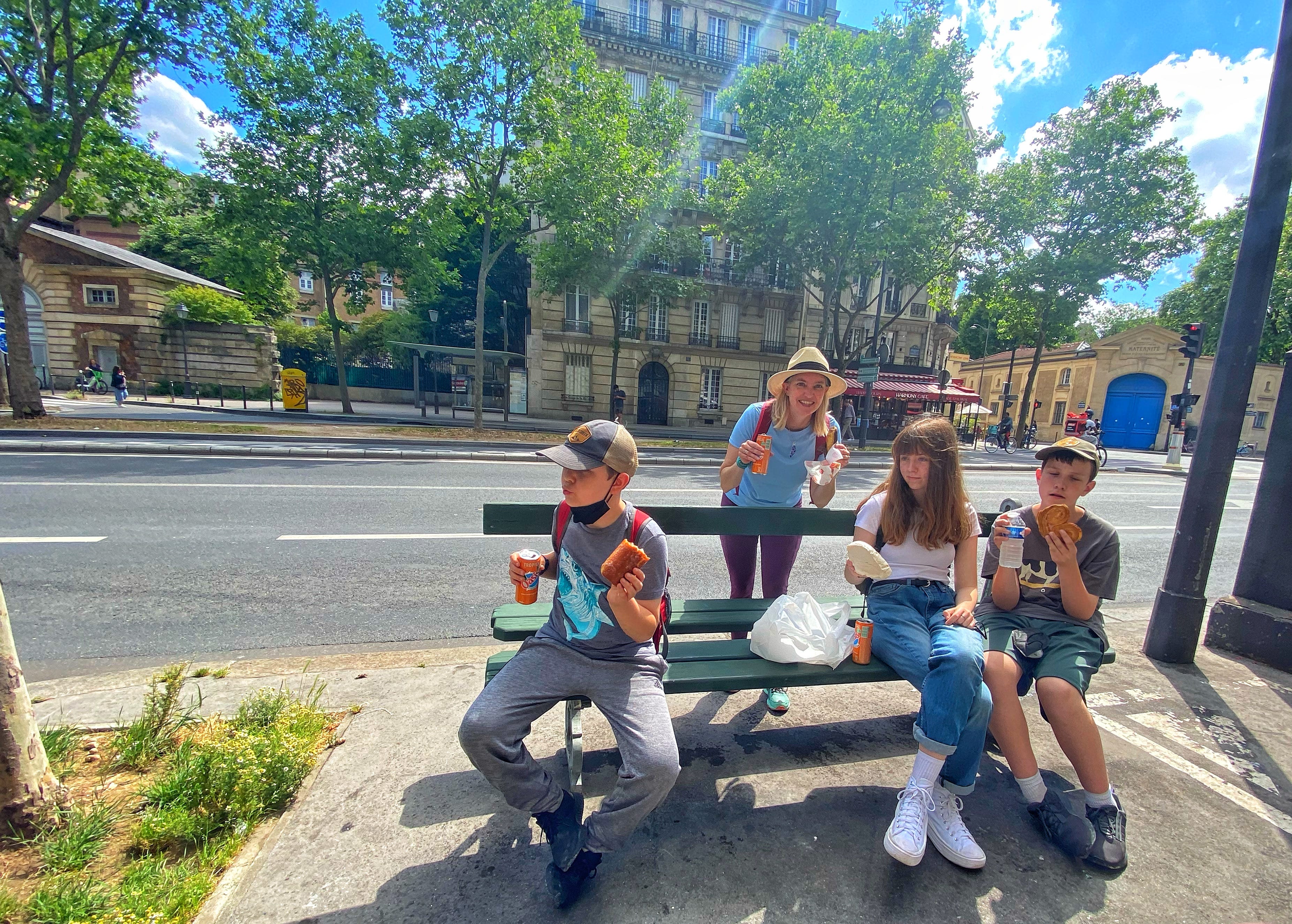 The author's children enjoy a food tour on a family trip to Paris.