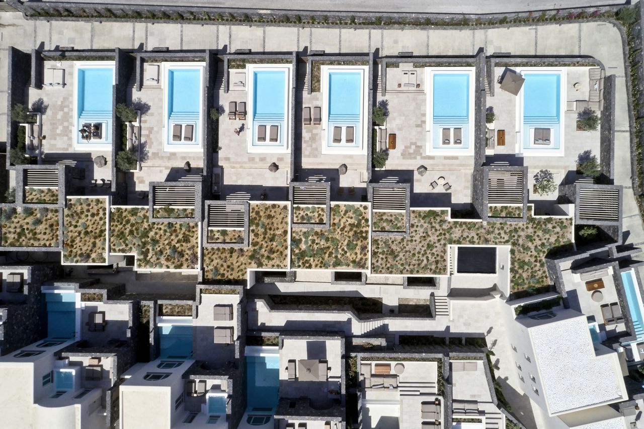 Overhead view of a resort with multiple pools and connecting terraces