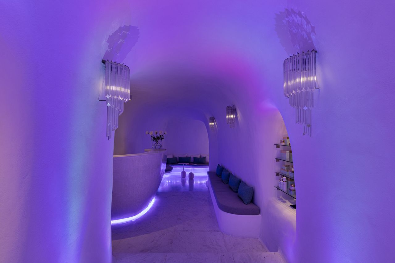 A luxurious spa interior with curved walls and ambient lighting