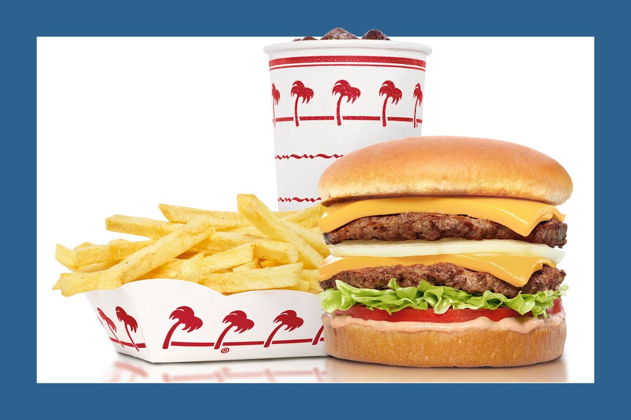 Burger fries and a drink from fastfood restaurant served on branded packaging