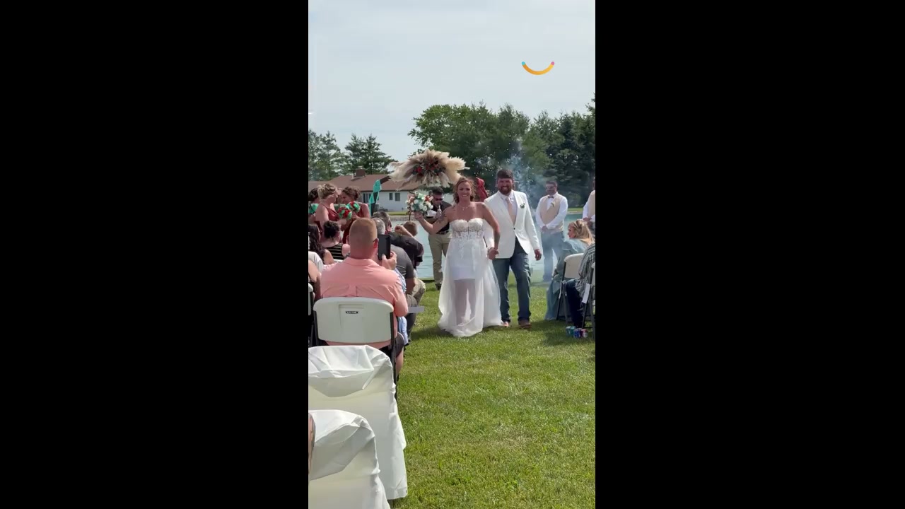 Bride and groom see funny side when wedding arch catches fire | Happily TV