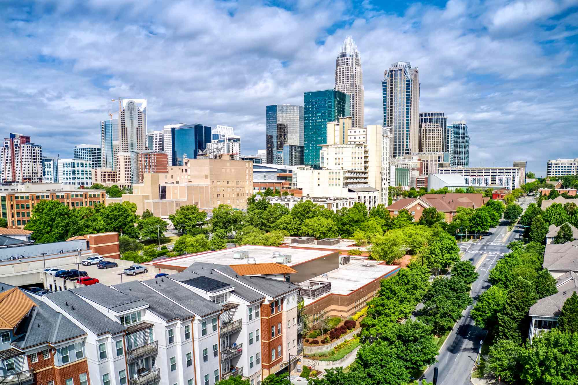 A view of the Charlotte North Carolina city skyline with buildings and trees