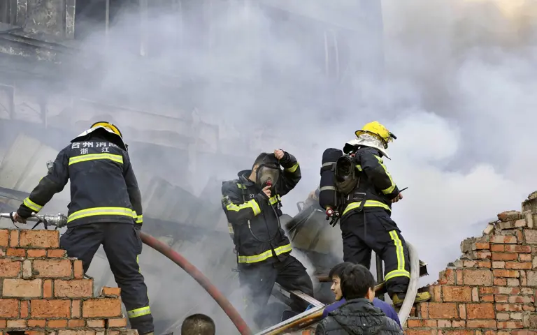 Chinese firefighters battle a blaze at the Huiteng Shoes factory in eastern China. (AFP pic)