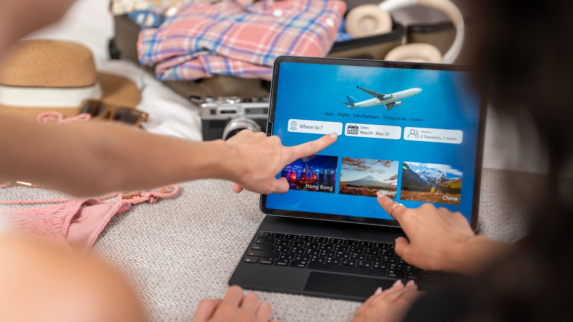 Discover two people planning a vacation on laptop computer featuring a search for affordable flights