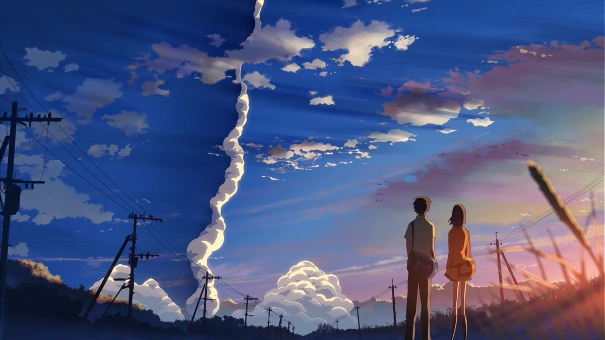A boy and girl stare up into the sky in